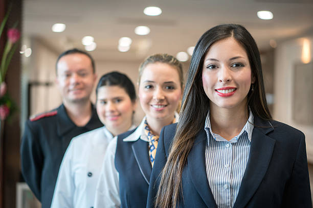 Portrait to a Latin American group of people working at the hotel and looking at the camera